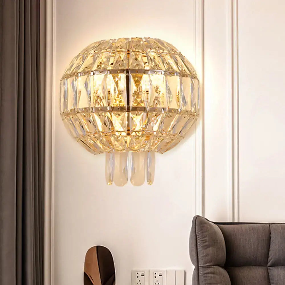 Butterfly tiered gold finish crystal wall sconce with faceted glass panels and dangling teardrop crystals for bedroom lighting