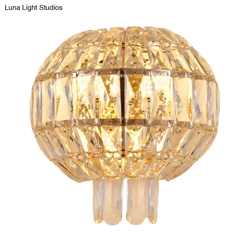 Butterfly tiered gold finish crystal wall sconce with illuminated golden globe pendant and faceted panels for bedroom light