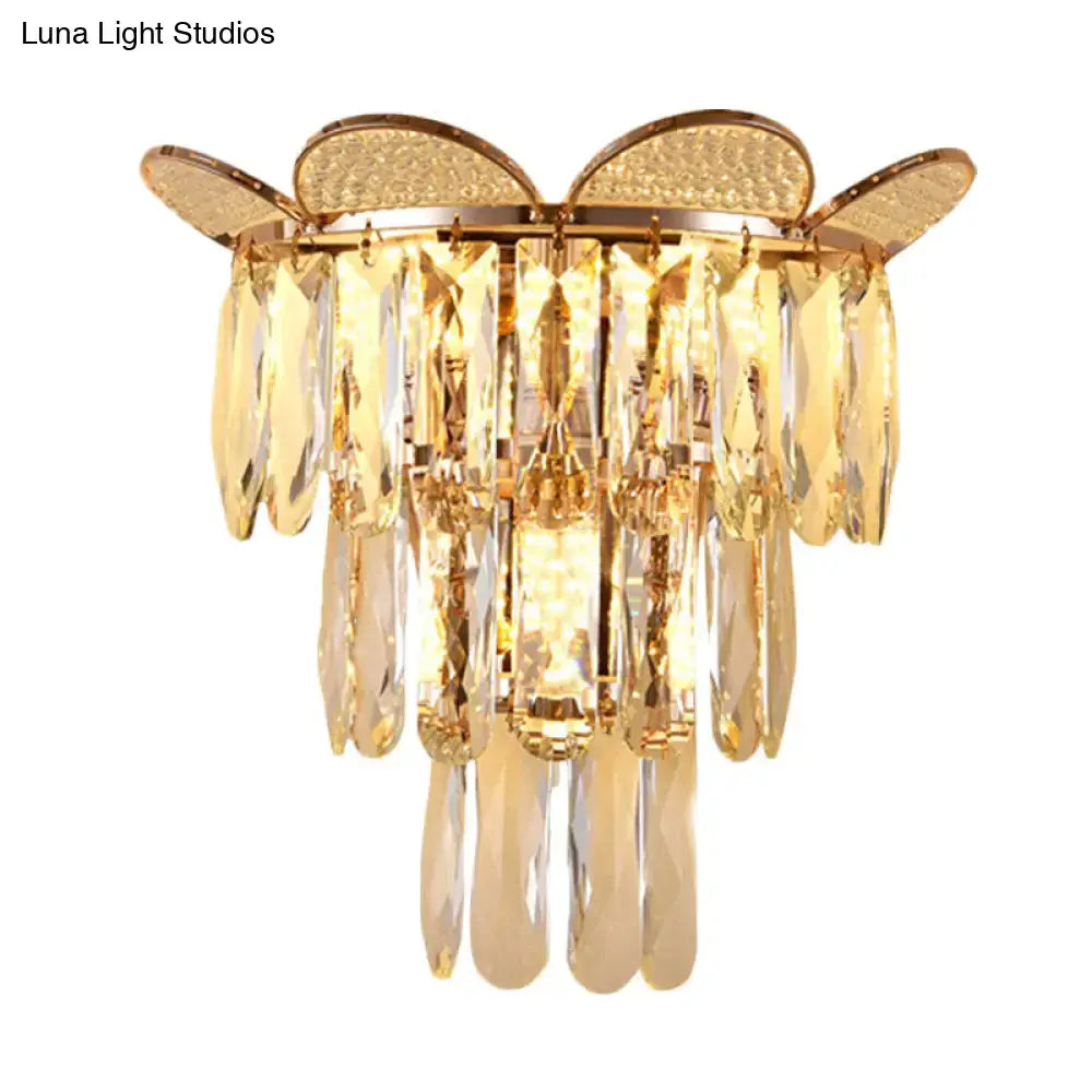 Gold finish butterfly tiered wall sconce with crystal teardrop pendants for elegant bedroom lighting