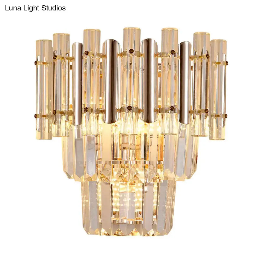 Butterfly tiered gold finish crystal wall sconce with gold-toned clear glass tubes for modern bedroom lighting