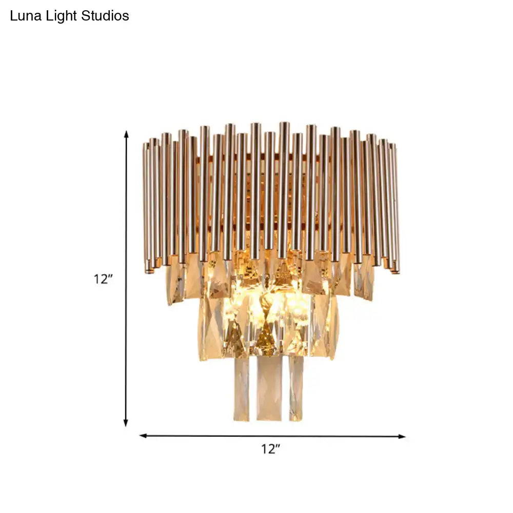 Butterfly tiered gold finish crystal wall sconce with vertical metallic rods and cascading faceted crystals for bedroom lighting