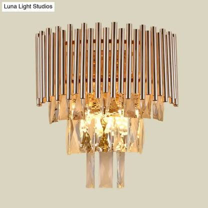 Butterfly tiered gold finish crystal wall sconce with vertical metallic rods and cascading faceted crystals for bedroom lighting