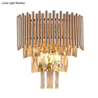 Butterfly tiered gold finish crystal wall sconce with vertical metallic rods and cascading faceted crystals for bedroom lighting