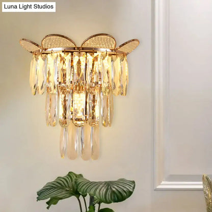 Gold finish butterfly tiered wall sconce with cascading crystal droplets for elegant bedroom lighting