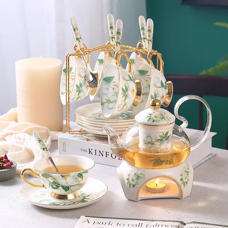 White porcelain tea set with gold trim and delicate green floral design from decorbites camellia floral tea collection
