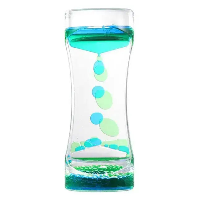 A clear glass liquid motion sand timer with swirling blue and green liquids and floating translucent bubbles for living room decor