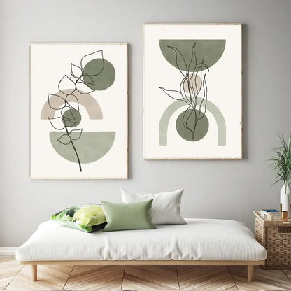 Two framed decorbites™ vintage boho canvas wall art prints featuring abstract geometric leaves in muted sage green and beige