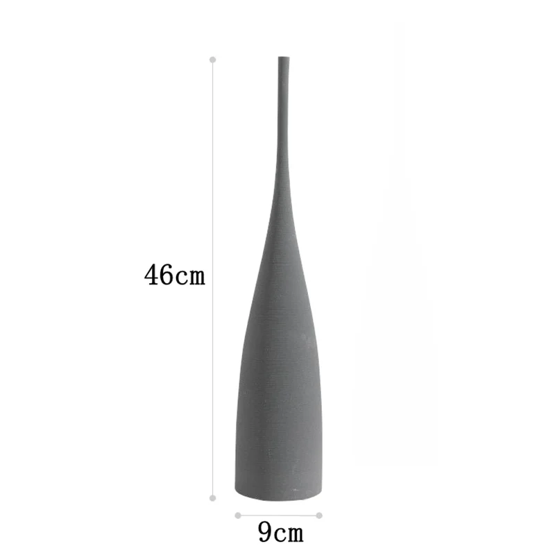 A sleek matte gray ceramic capiron zen vase with tall slender neck and flared base for nordic home decoration