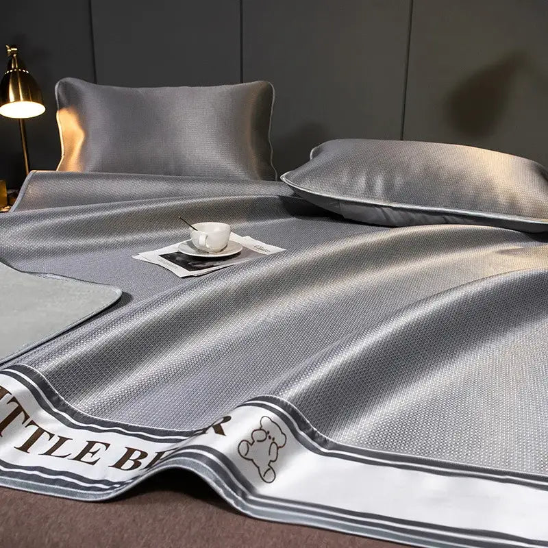 Gray satin-like carbon light cooling mat and pillowcase set with textured weave and bear embroidery for light cooling decorbites carbon light