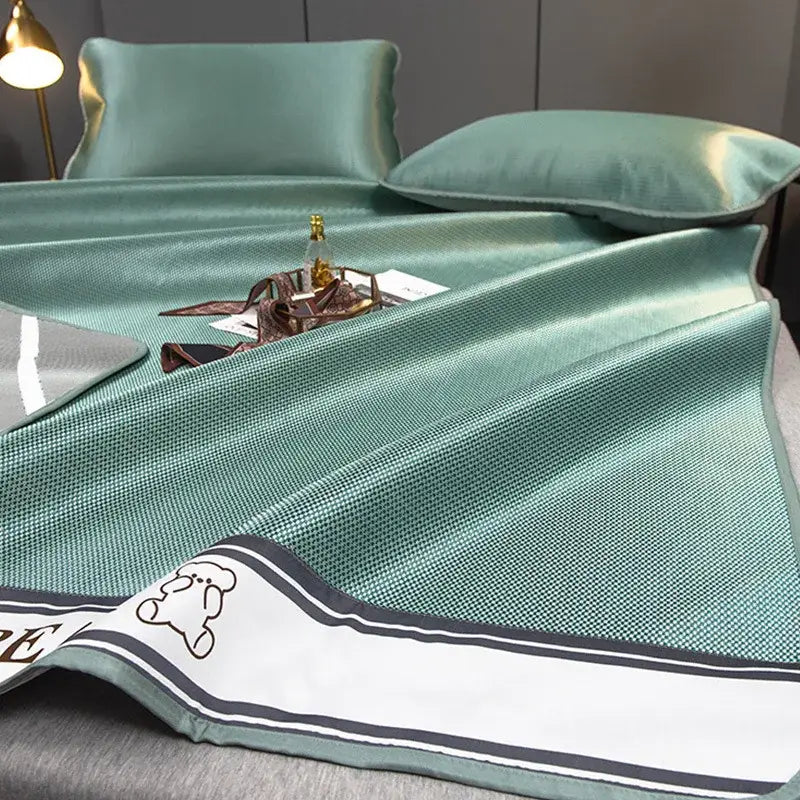 Teal carbon light cooling bed sheet with textured weave, white border black stripes, cartoon bear for light cooling mat set