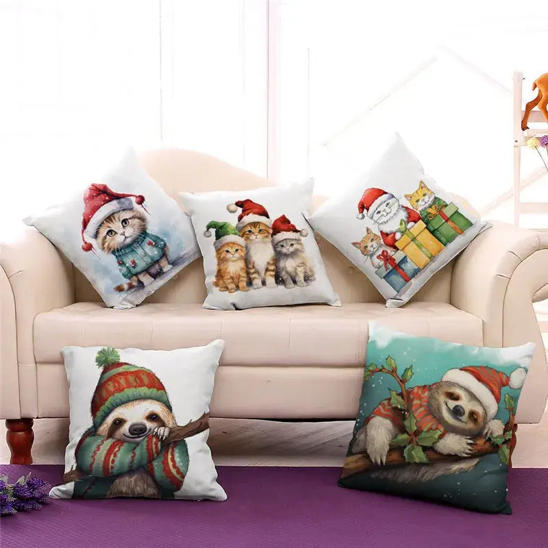 White cushion with soft fabric featuring festive cartoon animal christmas design of cats and sloths wearing santa hats decorbites cartoon animal