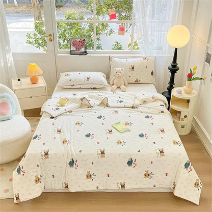 Cream-colored quilted kids summer quilt with soft knitted texture and cartoon bears floral pattern by decorbites kids summer