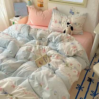 Light blue floral patterned cotton quilt cover set with delicate pink and purple blossoms for bedroom bedding