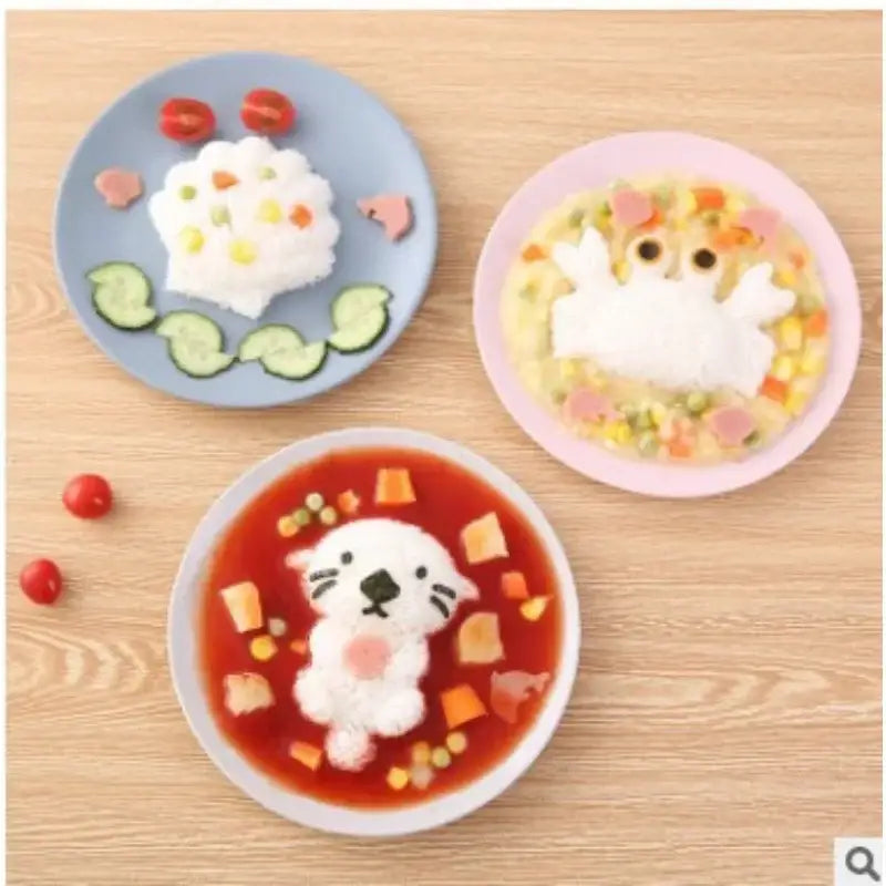 Three colorful plates display whimsical rice animals made using a cartoon animal sushi mold set for kitchen use