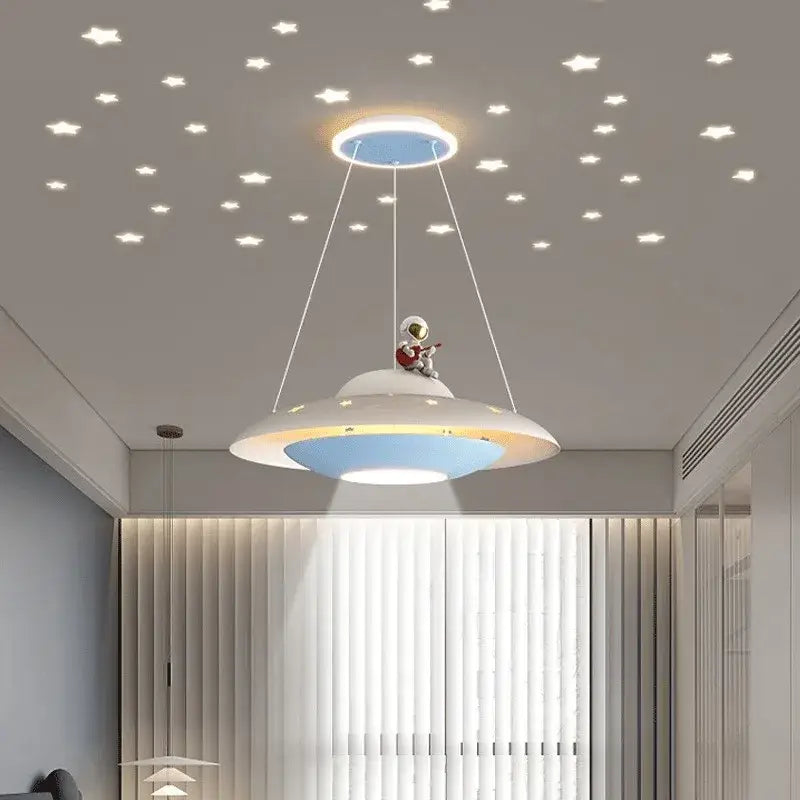 Whimsical white and blue ufo-shaped pendant light with astronaut figurine playing guitar for bedroom decorbites cartoon astronaut chandelier