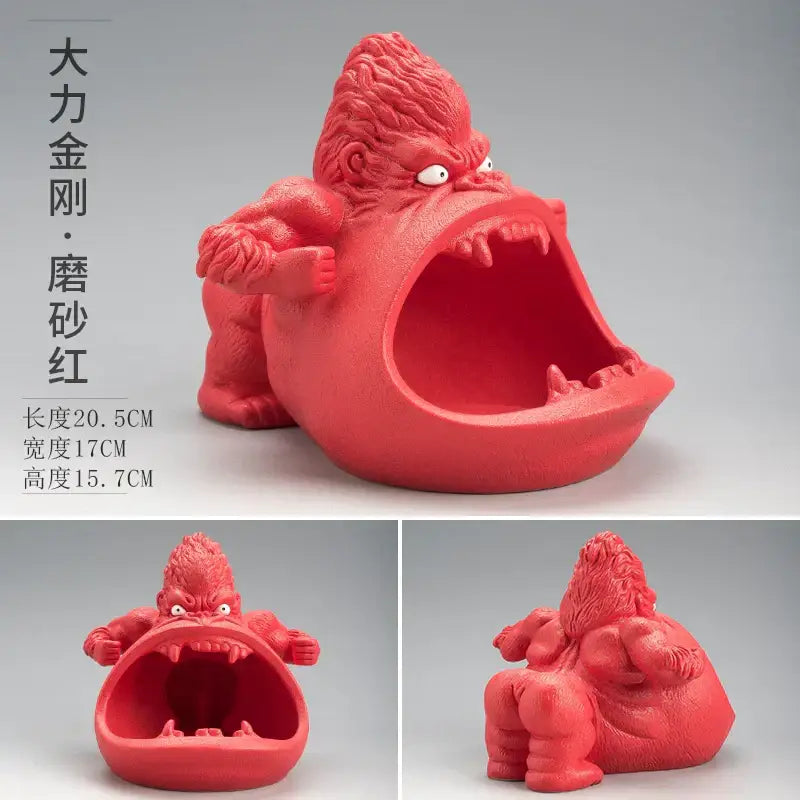 A vibrant red glossy resin gorilla ceramic ashtray with detailed fur and sharp teeth for living room decorbites gorilla ceramic