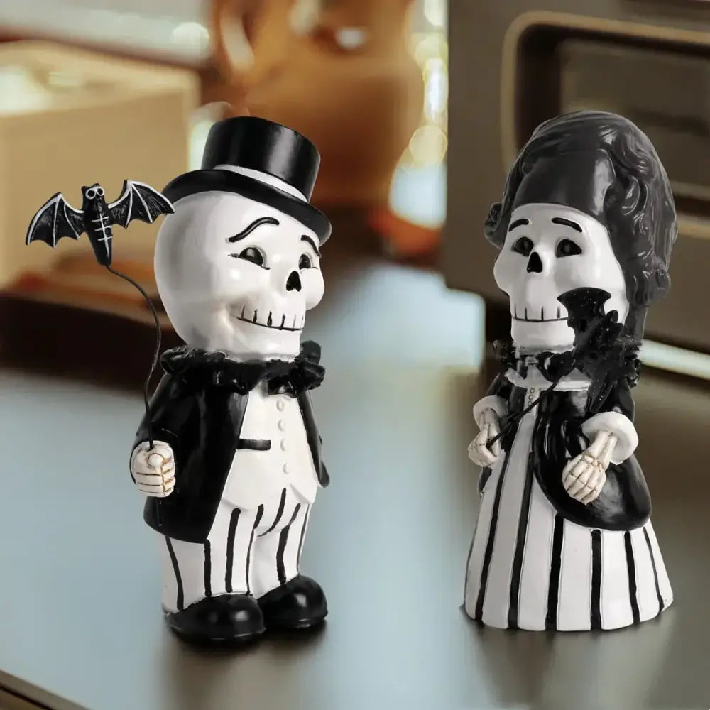 Black and white skeleton gentleman bat couple figurines dressed in formal attire for living room decor