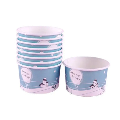 Stack of light blue and white decorbites cartoon paper cups with lids featuring village design and happy time script