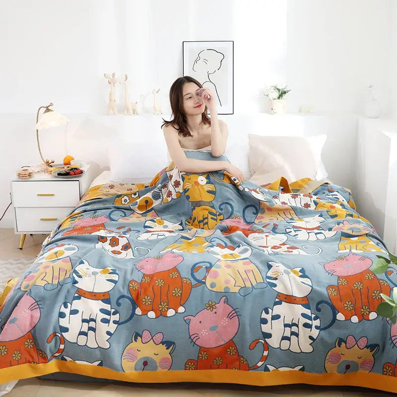 Cozy blue decorbites cartoon boho bedspread featuring colorful cartoon cats and floral accents in woven cotton for bedroom decor