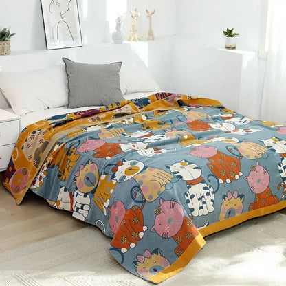 A cozy blue woven cotton decorbites cartoon boho bedspread featuring playful cats in colorful outfits with yellow trim