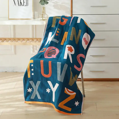 Teal cotton gauze bath towel with multicolored alphabet design for bedroom and nursery decorbites cotton gauze bath