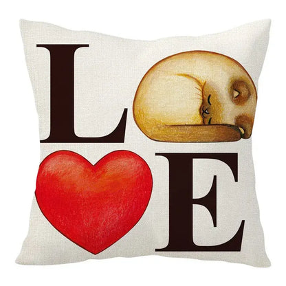 White linen cartoon cat linen throw pillow with cozy sleeping cat illustration and bold black love lettering with red heart