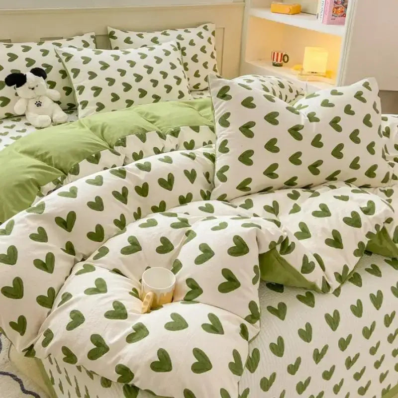 White and green heart-patterned cotton duvet cover set featuring cartoon cat and pink floral design for bedroom bedding