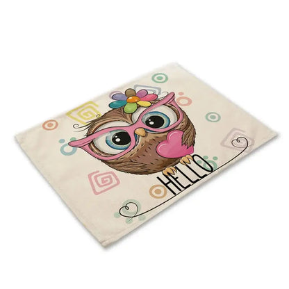 Cream-colored cotton dining table placemat with decorbites cute owl wearing pink glasses and hello script design