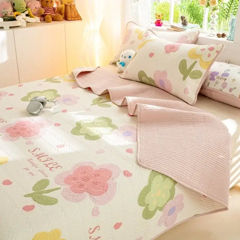 Pastel floral quilted cotton bed cover set with pink green and yellow blossoms on cream background for bedroom use
