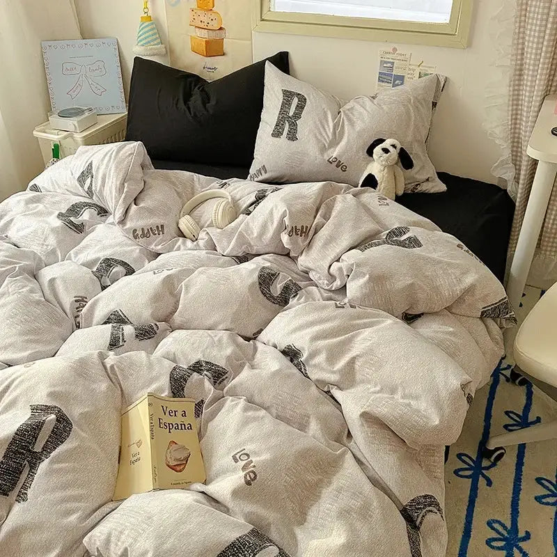 Cozy off-white cotton fitted sheet set with bold black love graphic print from cartoon dog and cupcake bedroom bedding