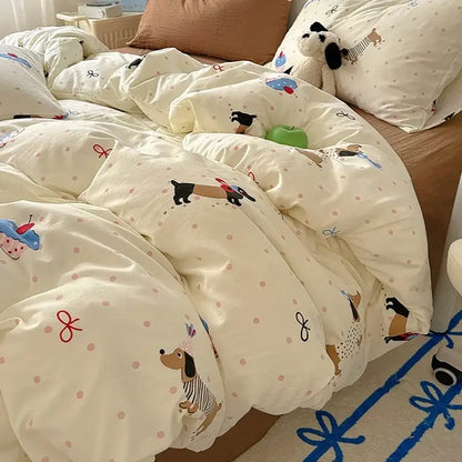 Cream-colored cotton fitted sheet set with cartoon dachshund, cupcake prints, pink polka dots, and red bows for bedroom bedding