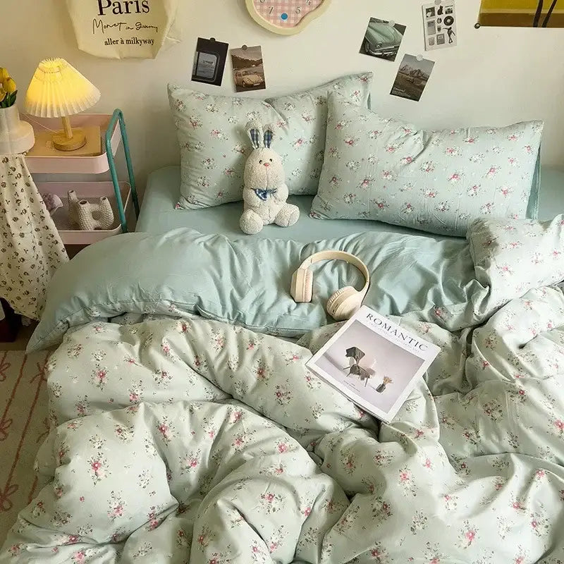 Mint green floral patterned bedding set shown with a cream comforter set featuring decorbites cartoon style dog print
