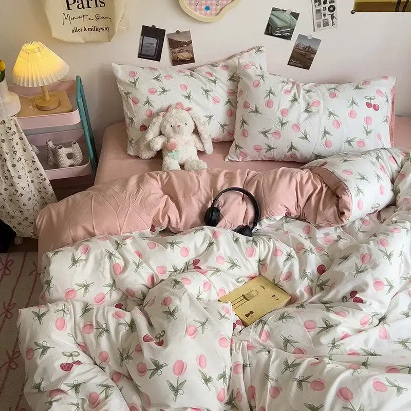 Pink and white cherry-patterned quilted bedding set complementing the decorbites cartoon style comforter set for bedroom