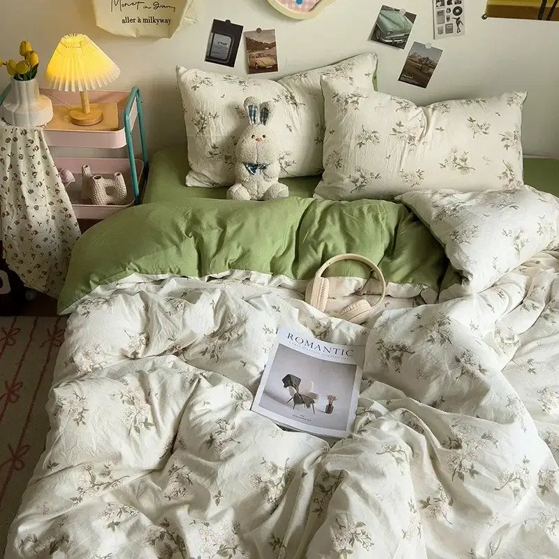 Cartoon dog printed cream comforter bedding set featuring white floral pattern with soft green accents and plush bunny pillow