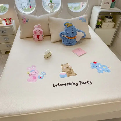 Cream-colored decorbites cartoon embroidered fitted sheet featuring embroidered characters and interesting party text