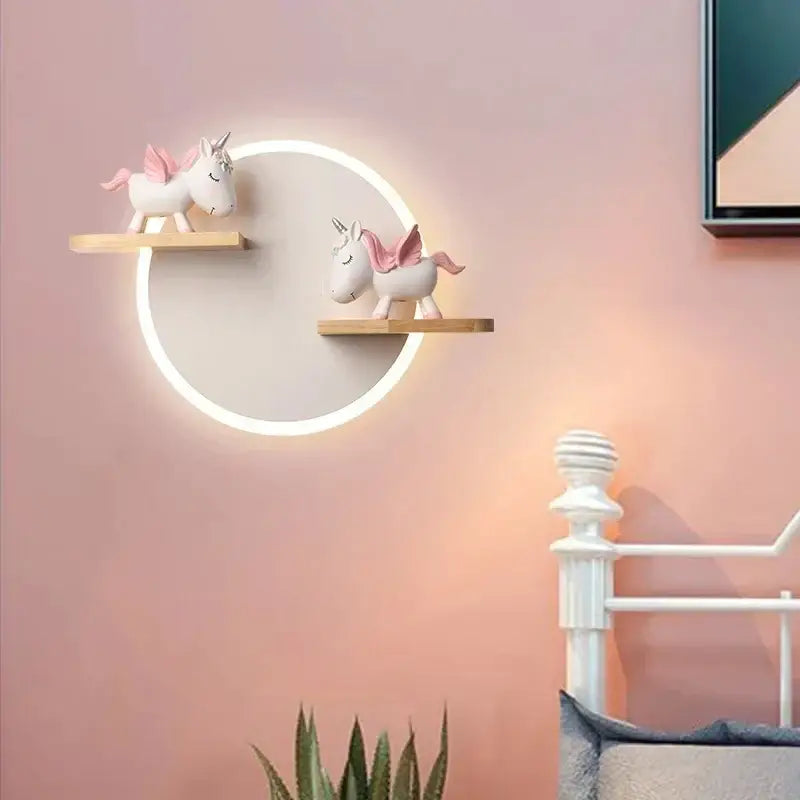 Cartoon figurine led wall lamp with circular white glowing ring and wooden shelves holding pink unicorns for bedroom decorbites led wall