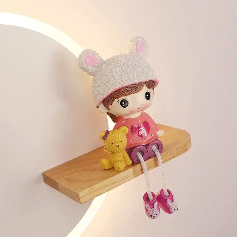 Cute bunny-eared doll figurine with fluffy gray hat and pink polka-dot shirt as decorbites led wall lamp with wooden shelf
