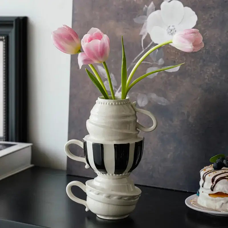 Stacked black and white ceramic folding cup vase with pink tulips decorbites cartoon folding cup for living room decor