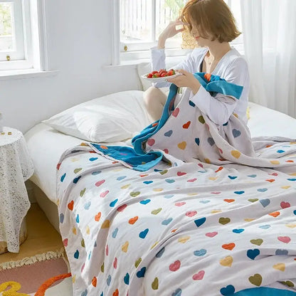 Cozy cartoon lion cotton throw with plush multicolored heart pattern and bright blue border for decorbites bedroom decor