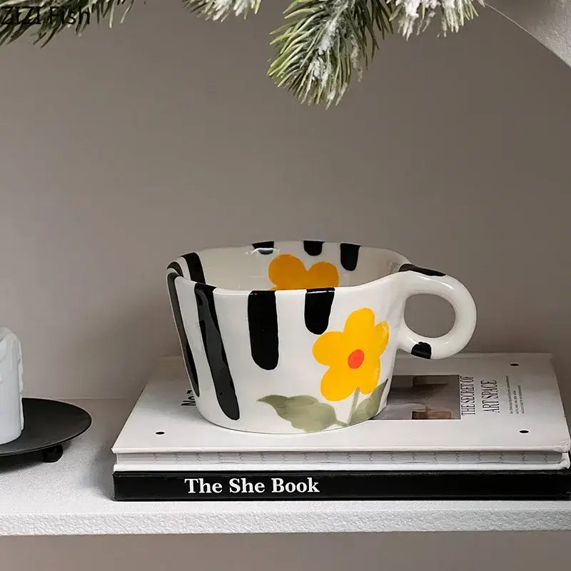 White ceramic cartoon pattern ceramic mug with bold black stripes and yellow flower from decorbites mug set