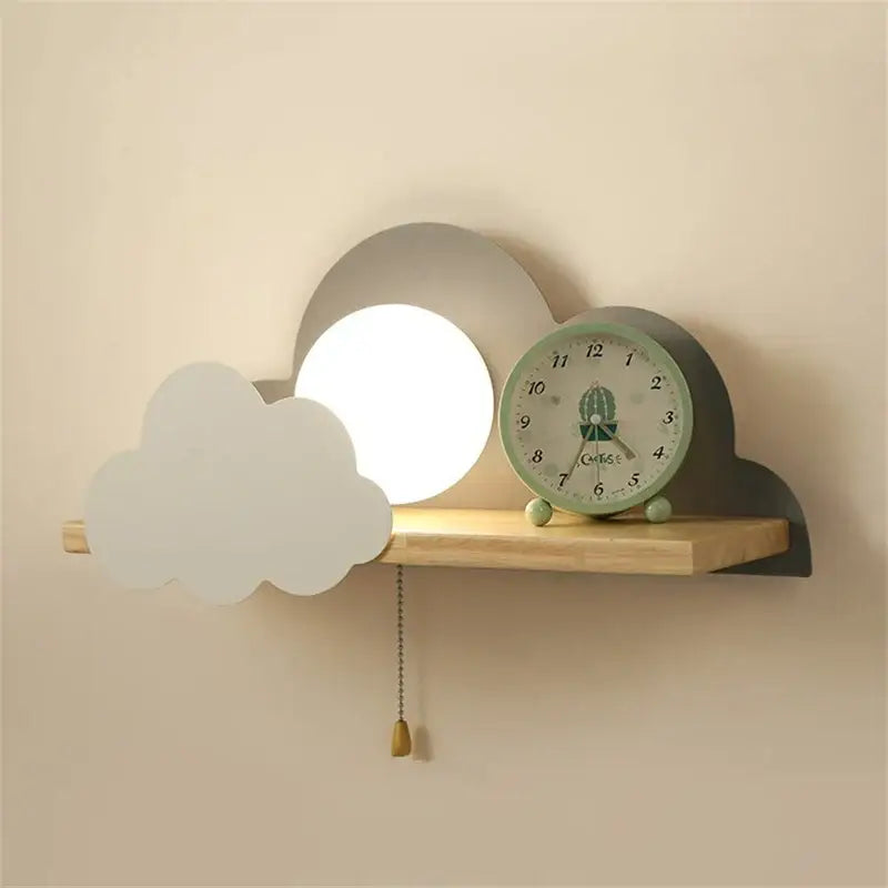 Cartoon peach and white cloud moon wall lamp with soft white illuminated circle matte gray cutouts and wooden shelf base decorbites cloud moon wall lamp
