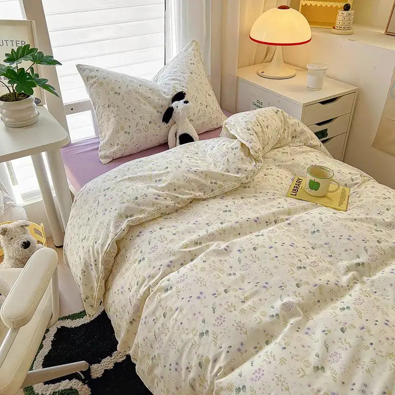 Cream-colored decorbites cartoon printed bedding sets with pastel floral patterns in soft cozy fabric for bedroom use