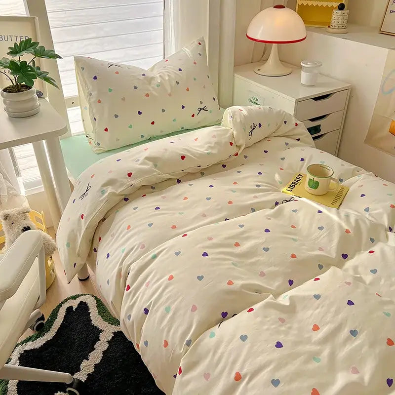 Cream-colored cartoon printed bedding set with multicolored hearts for decorbites cartoon printed bedroom decor
