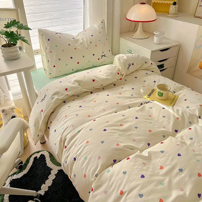 Cream-colored cartoon printed bedding set with multicolored hearts for decorbites cartoon printed bedroom decor