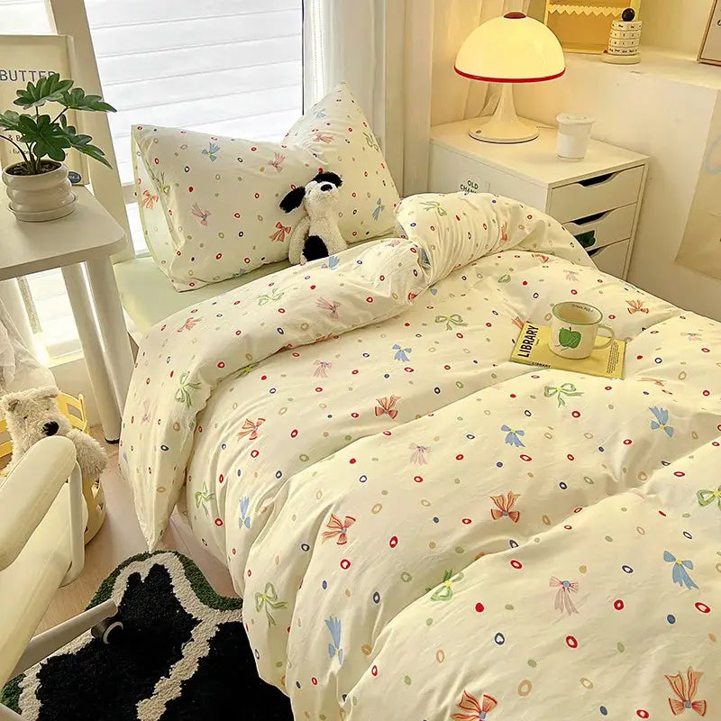Cream-colored duvet set from decorbites cartoon printed bedding sets featuring pastel bows and colorful dots pattern