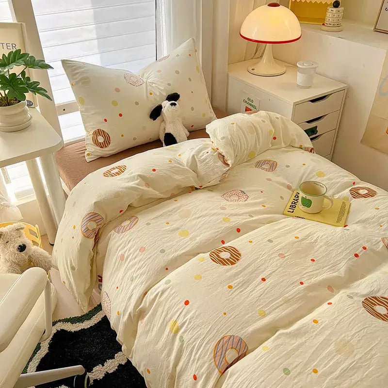 Cream-colored cotton duvet set from decorbites cartoon printed bedding sets featuring pastel donut and polka dot pattern