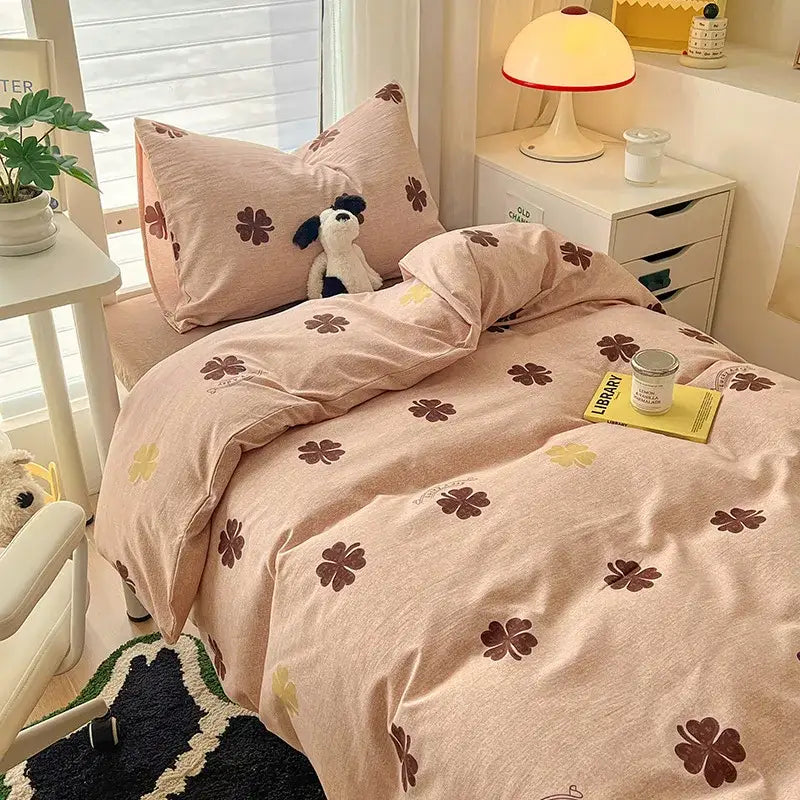 Pink four-leaf clover cartoon printed bedding set with brown and yellow accents by decorbites for bedroom decor