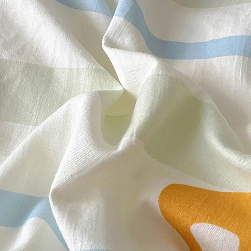 Soft white and light blue striped fabric with bold yellow abstract shape in decorbites cartoon printed bedding sets