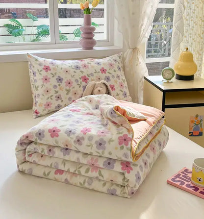 A soft cooling blanket with pastel floral pattern on cream background for decorbites cartoon printed summer use