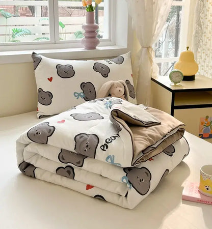 Cartoon printed white and yellow cooling blanket with gray bear and red heart patterns soft plush texture for summer use